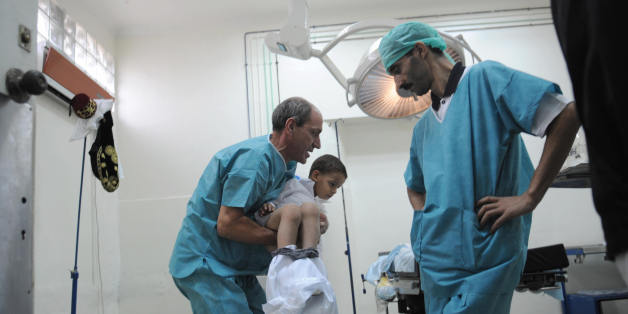 Algerian doctors prepare a boy to be circumcised during a mass circumcision at a local hospital September 27, 2008. in Algiers. The Muslim religion stresses cleanliness, and circumcision in many Islamic nations is considered a form of natural hygiene, with the event being often viewed communally as a joyous occasion and celebrated. AFP PHOTO FAYEZ NURELDINE (Photo credit should read FAYEZ NURELDINE/AFP/Getty Images)
