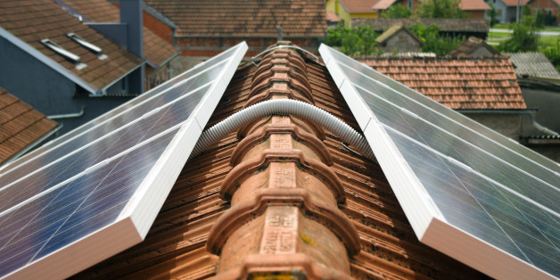 Detail of cable connecting solar panels on the house roof
