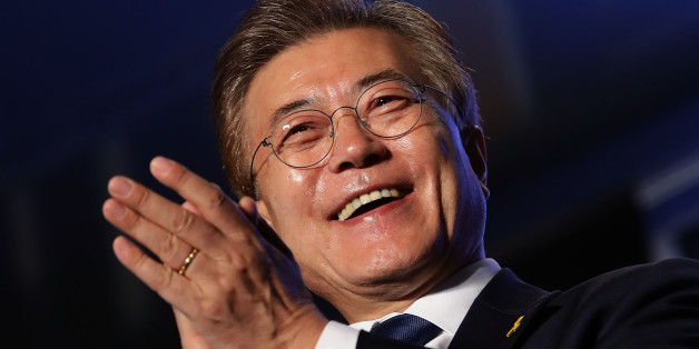 SEOUL, SOUTH KOREA - MAY 09: South Korean President-elect Moon Jae-in, of the Democratic Party of Korea, celebrates with supporters at Gwanghwamun Square on May 9, 2017 in Seoul, South Korea. Moon Jae-in declared victory in South Korea's presidential election, which was called seven months early after former President Park Geun-hye was impeached for her involvement in a corruption scandal. (Photo by Chung Sung-Jun/Getty Images)