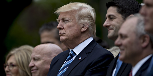 U.S. President Donald Trump, center, listens during a press conference in the Rose Garden of the White House in Washington, D.C., U.S., on Thursday, May 4, 2017. House Republicans mustered just enough votes to pass their health-care bill Thursday, salvaging what at times appeared to be a doomed mission to repeal and partially replace Obamacare under intense pressure from Trump to produce legislative accomplishments. Photographer: Andrew Harrer/Bloomberg via Getty Images