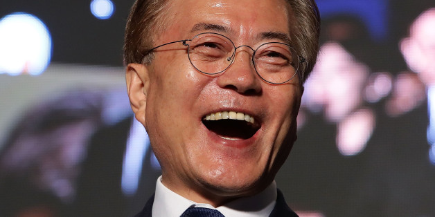 SEOUL, SOUTH KOREA - MAY 09: South Korean President-elect Moon Jae-in, of the Democratic Party of Korea, celebrates with supporters at Gwanghwamun Square on May 9, 2017 in Seoul, South Korea. Moon Jae-in declared victory in South Korea's presidential election, which was called seven months early after former President Park Geun-hye was impeached for her involvement in a corruption scandal. (Photo by Chung Sung-Jun/Getty Images)