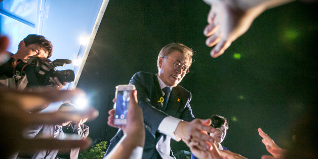 SEOUL, SOUTH KOREA - MAY 09: Mr. Moon Jae-in, the president-elect, greets supporters after his victory was confirmed on the presidential election on May 9, 2017 in Seoul, South Korea. The liberal presidential candidate had some 6.25 million, or 39.5 percent, of the 15.88 million votes counted so far, according to the National Election Commission. (Photo by Jean Chung/Getty Images)