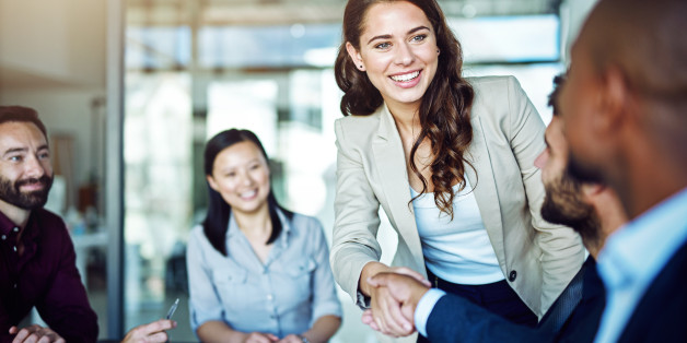 Cropped shot of two businesspeople shaking hands during a meeting in the boardroom