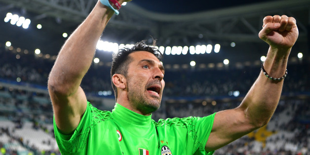TURIN, ITALY - MAY 09: Gianluigi Buffon of Juventus celebrates as a flyer for the Cardiff final flys infront of him after the UEFA Champions League Semi Final second leg match between Juventus and AS Monaco at Juventus Stadium on May 9, 2017 in Turin, Italy. (Photo by Stuart Franklin/Getty Images)