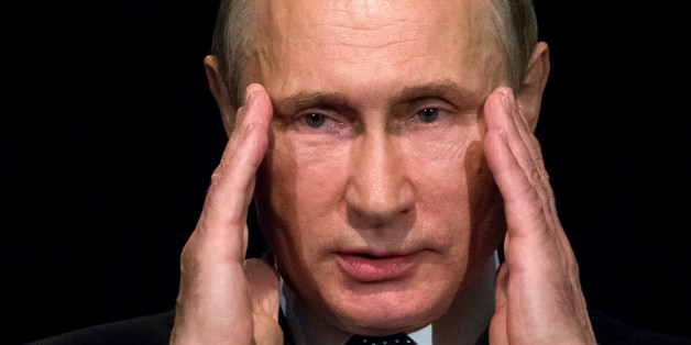 Russian President Vladimir Putin gestures as he addresses students during his visit to the German Embassy school in Moscow, Russia, June 29, 2016. REUTERS/Alexander Zemlianichenko/Pool/File Photo