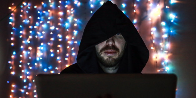 ST PETERSBURG, RUSSIA - JANUARY 31, 2017: A man in a hood sits at a laptop computer. Sergei Konkov/TASS (Photo by Sergei Konkov\TASS via Getty Images)