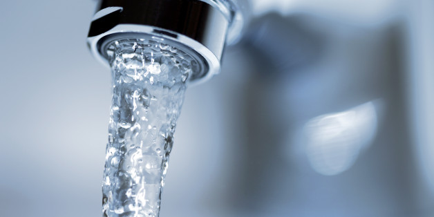Faucet close-up with running water.