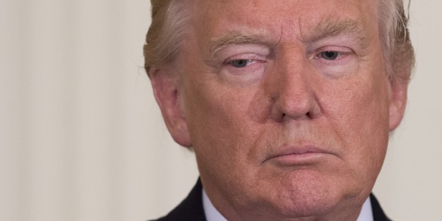 US President Donald Trump attends a Mother's Day event hosted by First Lady Melania Trump for military spouses in the East Room of the White House in Washington, DC, May 12, 2017. / AFP PHOTO / SAUL LOEB (Photo credit should read SAUL LOEB/AFP/Getty Images)