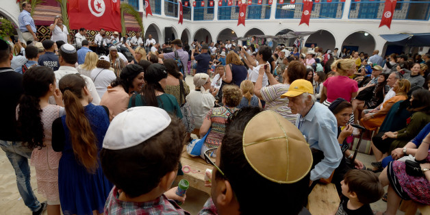 Jewish pilgrims take part in the annual pilgrimage to the Ghriba synagogue on the Tunisia's Mediterranean resort island of Djerba on May 12, 2017.
/ AFP PHOTO / FETHI BELAID (Photo credit should read FETHI BELAID/AFP/Getty Images)