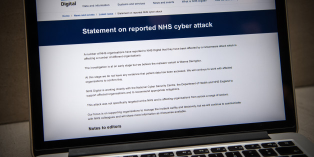 LONDON, ENGLAND - MAY 12: A message informing visitors of a cyber attack is displayed on the NHS website on May 12, 2017 in London, England. NHS hospitals across England have been hit by a large-scale cyber-attack with many hospitals having to divert emergency patients and doctors reporting messages demanding money. (Photo by Carl Court/Getty Images)