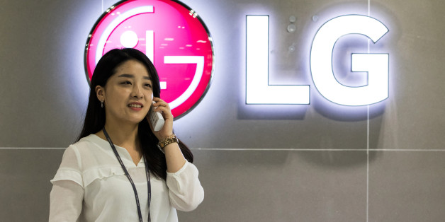 An LG Electronics Inc. employee speaks on the phone in the showroom of the company's factory in Changwon, South Korea, on Thursday, June 9, 2016. LG, with businesses spanning TVs to washing machines, is looking at home appliance acquisitions to fuel its global expansion and withstand a slowing smartphone market. Photographer: SeongJoon Cho/Bloomberg via Getty Images
