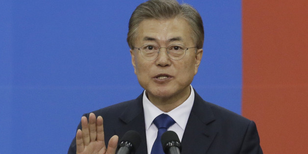 Newly elected South Korean President Moon Jae-in takes an oath during his inauguration ceremony at the National Assembly in Seoul on May 10, 2017.
Moon was sworn in just a day after a landslide election victory, and immediately declared his willingness to visit Pyongyang amid high tensions with the nuclear-armed North. / AFP PHOTO / POOL / Ahn Young-joon (Photo credit should read AHN YOUNG-JOON/AFP/Getty Images)