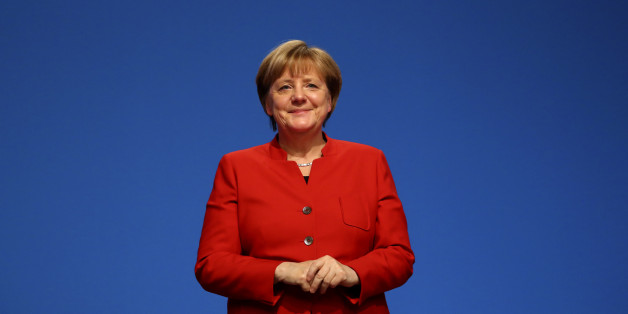German Chancellor and leader of the conservative Christian Democratic Union party CDU Angela Merkel reacts after she was re-elected as chairwoman at the CDU party convention in Essen, Germany, December 6, 2016. REUTERS/Kai Pfaffenbach