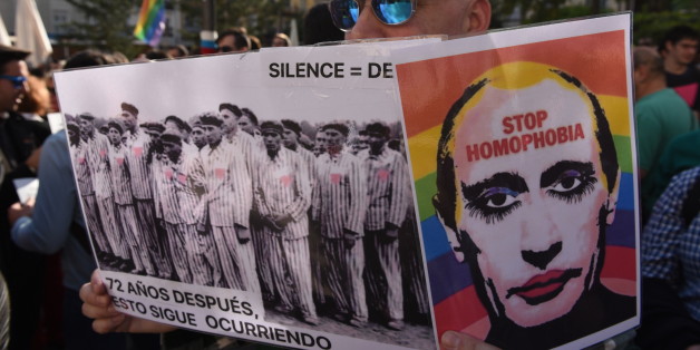 MADRID, SPAIN - 2017/04/25: A man holds a picture of Vladimir Putin as he takes part in a protest in Madrid against the persecution of gay men in Chechnya. (Photo by Jorge Sanz GarcÃa/Pacific Press/LightRocket via Getty Images)