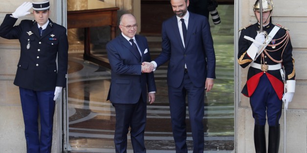 French newly appointed Prime Minister Edouard Philippe (R) is welcomed by his predecessor Bernard Cazeneuve (L) as they shake hands at the Hotel Matignon, in Paris on May 15, 2017, during an official handover ceremony. / AFP PHOTO / POOL / THOMAS SAMSON (Photo credit should read THOMAS SAMSON/AFP/Getty Images)