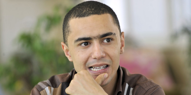 Tunisian rapper Ala Yaacoubi, better know by his rap name 'Weld El 15, arrives for his trial at the court in the Tunis suburb of Ben Arous on June 13, 2013. The Tunisian rapper risks up to seven years in prison for insulting the police has said he was 'afraid' ahead of his trial and criticised the authorities for not respecting freedom of expression. AFP PHOTO / FETHI BELAID (Photo credit should read FETHI BELAID/AFP/Getty Images)