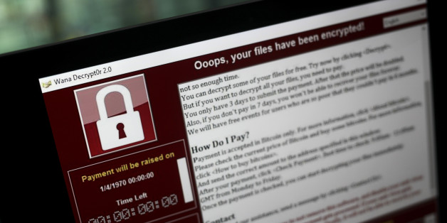 A lock screen from a cyber attack warns that data files have been encrypted on a laptop computer in this arranged photo in London, U.K., on Monday, May 15, 2017. Governments and companies around the world began to gain the upper hand against the first wave of an unrivaled global cyberattack, even as the assault was poised to continue claiming victims this week. Photographer: Simon Dawson/Bloomberg via Getty Images