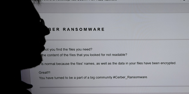 An IT researchers stands next to a giant screen a computer infected by a ransomware at the LHS (High Security Laboratory) of the INRIA (National Institute for Research in Computer Science and Automation) in Rennes, on November 3, 2016.
Paradise where computer viruses blossom under the watchful eye of scientists, the Laboratory of high security (LHS-PEC) of Rennes is a small fortress from where emerge the first studies on the 'ransomwares', those digital brigands which Dominate the malware market. / AFP PHOTO / DAMIEN MEYER (Photo credit should read DAMIEN MEYER/AFP/Getty Images)