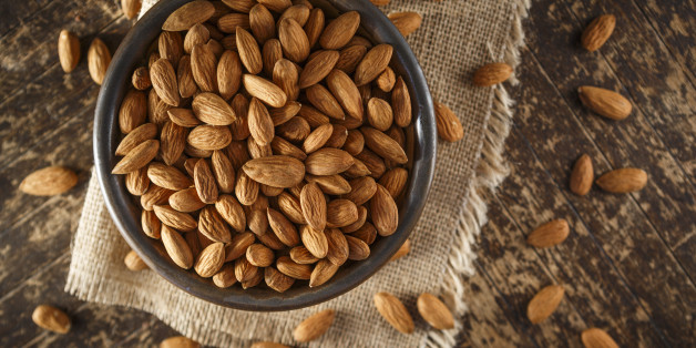 Raw Organic Almonds Photographed on a Piece of Burlap