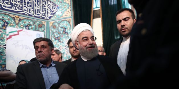 Iranian President and presidential candidate, Hassan Rouhani, casts his ballot for the presidential elections at a polling station in Tehran on May 19, 2017. / AFP PHOTO / Behrouz MEHRI (Photo credit should read BEHROUZ MEHRI/AFP/Getty Images)