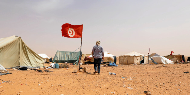 A Tunisian protester walks near his tent during a sit-in at El Kamour oilfield, near the town of Tatouine, Tunisia May 11, 2017. Picture taken May 11, 2017. REUTERS/Zoubeir Souissi