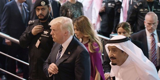 US President Donald Trump (C) and Saudi Arabia's King Salman bin Abdulaziz al-Saud (R) take part in a welcome ceremony ahead of a banquet at Murabba Palace in Riyadh on May 20, 2017. / AFP PHOTO / MANDEL NGAN (Photo credit should read MANDEL NGAN/AFP/Getty Images)
