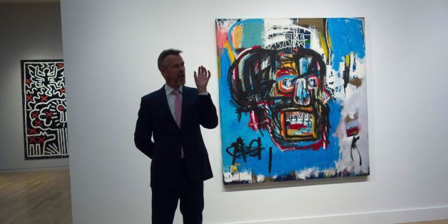 A Sotheby's official speaks about an untitled painting by Jean-Michel Basquiat during a media preview May 5, 2017 at Sotheby's In New York.
The piece is one of the creations to be auctioned during the Impressionist and Modern Art evening sale May 16, 2017 in New York / AFP PHOTO / Don Emmert (Photo credit should read DON EMMERT/AFP/Getty Images)