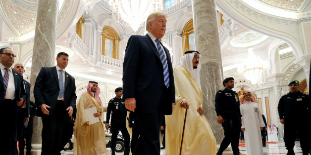 U.S. President Donald Trump walks with Saudi Arabia's King Salman bin Abdulaziz Al Saud to deliver remarks to the Arab Islamic American Summit in Riyadh, Saudi Arabia May 21, 2017. REUTERS/Jonathan Ernst