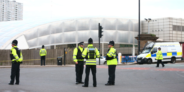 MANCHESTER, ENGLAND - MAY 23: Police officers stand at the Miller Street and Corporation Street Crossroads, in front of the Manchester Arena on May 23, 2017 in Manchester, England. An explosion occurred at Manchester Arena as concert goers were leaving the venue after Ariana Grande had performed. Greater Manchester Police have confirmed 19 fatalities and at least 50 injured. (Photo by Dave Thompson/Getty Images)