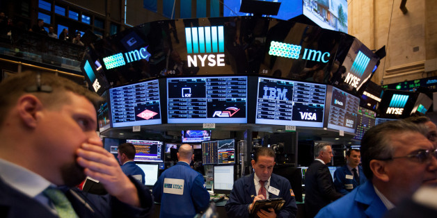 Traders work on the floor of the New York Stock Exchange (NYSE) in New York, U.S., on Monday, May 22, 2017. U.S. stocks advanced for a third day as President Donald Trump's trip to Saudi Arabia netted deals that lifted industrial shares and crude pushed above $50 a barrel before OPEC meets this week. Photographer: Michael Nagle/Bloomberg via Getty Images
