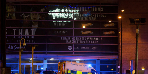 A police van and an ambulance are seen outside the Manchester Arena, where U.S. singer Ariana Grande had been performing, in Manchester, northern England, Britain May 22, 2017. REUTERS/Jon Super TPX IMAGES OF THE DAY