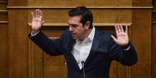 Greek Prime Minister Alexis Tsipras gestures as he delivers a speech during a parliamentary session in Athens on May 18, 2017.
Greece's parliament was to approve a new round of austerity cuts, hoping to secure a pledge of debt relief and loan disbursements by the country's EU-IMF creditors this month. / AFP PHOTO / Angelos Tzortzinis (Photo credit should read ANGELOS TZORTZINIS/AFP/Getty Images)