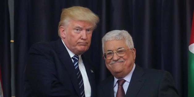 BETHLEHEM, WEST BANK - MAY 23: Palestinian president Mahmoud Abbas (R) and US President Donald Trump (L) shake hands during their joint press conference following their meeting on May 23, 2017 in Bethlehem, West Bank. (Photo by Issam Rimawi/Anadolu Agency/Getty Images)