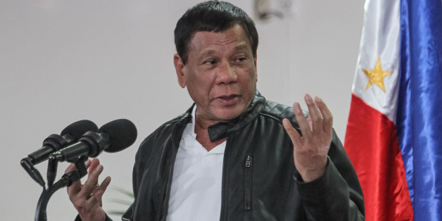 Philippine President Rodrigo Duterte gestures as he speaks shortly after arriving in Davao on May 16, 2017, from a working visit to China.Duterte said on May 16 he was open to jointly exploration with Beijing resources in the disputed South China Sea, following a meeting with Chinese President Xi Jinping. / AFP PHOTO / MANMAN DEJETO (Photo credit should read MANMAN DEJETO/AFP/Getty Images)