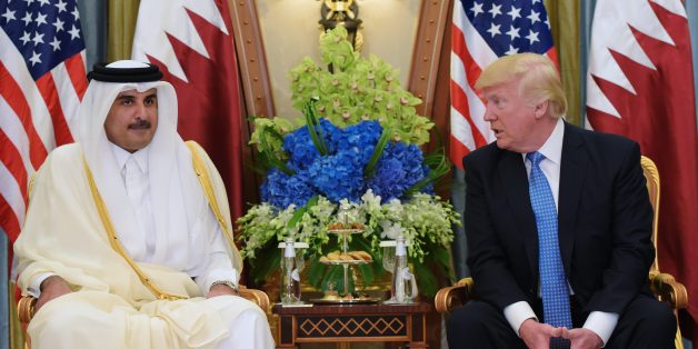 US President Donald Trump (R) and Qatar's Emir Sheikh Tamim Bin Hamad Al-Thani take part in a bilateral meeting at a hotel in Riyadh on May 21, 2017. / AFP PHOTO / MANDEL NGAN (Photo credit should read MANDEL NGAN/AFP/Getty Images)