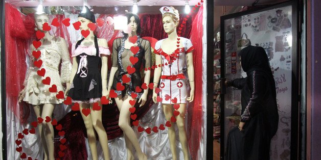 Lifestyle-Gulf-Bahrain-social-sex, by Mohammad Fadhel A woman enters a sex shop in Isa, north of the Bahraini capital Manama, on May 19, 2010. 'Darkhadija' appears to be just another lingerie shop from outside, but it actually is the first sex shop in the kingdom of Bahrain. AFP PHOTO/ADAM JAN (Photo credit should read ADAM JAN/AFP/Getty Images)