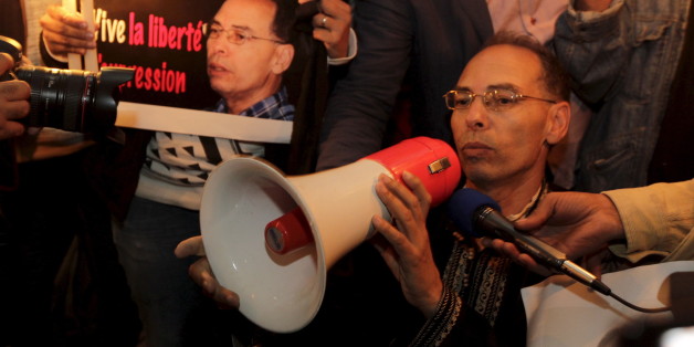 Maati Monjib, a professor of political history and African studies at the University of Rabat and a writer for national and international news organisations, and his supporters participate in a demonstration near the "Moroccan Human Rights Association" (AMDH) in Rabat October 28, 2015. Monjib started a second hunger strike after authorities banned him from boarding a plane to Norway for an international conference on journalism in Lillehammer. REUTERS/Stringer