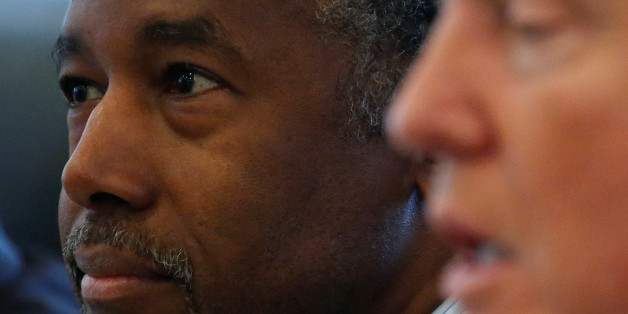 Dr. Ben Carson (L) and Republican presidential nominee Donald Trump speak during a round table with the Republican Leadership Initiative at Trump Tower in the Manhattan borough of New York, U.S., August 25, 2016. REUTERS/Carlo Allegri
