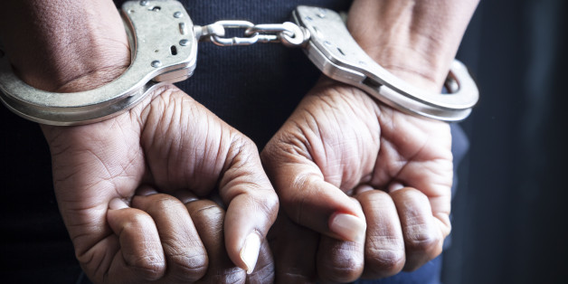 Black woman in handcuffs