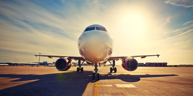 Airplane is taxiing to take off at the sunrise