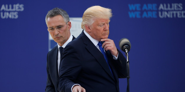 U.S. President Donald Trump reacts as he speaks beside NATO Secretary General Jens Stoltenberg at the start of the NATO summit at their new headquarters in Brussels, Belgium, May 25, 2017.REUTERS/Jonathan Ernst