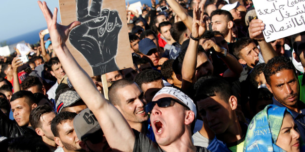 Thousands of Moroccans shout slogans during a demonstration in the northern town of Al-Hoceima, seven months after a fishmonger was crushed to death inside a garbage truck as he tried to retrieve fish confiscated by the police, in Al-Hoceima, Morocco May 18, 2017. REUTERS/Youssef Boudlal