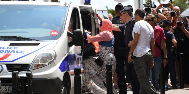 A woman enters a Police van after being arrested by Police on May 26, 2017 outside the luxury Martinez hotel, before she attempted with other women to take part in a bathing in full-body Islamic burkini swimsuit on a beach of Cannes, during the 70th edition of the Cannes Film Festival in Cannes, southern France.
About ten women who planned to bath in burkini on May 26 were arrested by police in Cannes, in front of the luxury Martinez hotel, on the grounds no demonstration had been allowed by the prefecture. The women, who all came by train from Paris for the event, are friends or relatives of Algerian businessman Rachid Nekkaz, who has made himself known since 2010 by paying the fines of women who dot not comply with France's local legislation. Nekkaz said by attempting to organise the event, he was aiming at recalling an August 26, 2016 court ruling by the Council of State that suspended the burkini ban. / AFP PHOTO / Anne-Christine POUJOULAT (Photo credit should read ANNE-CHRISTINE POUJOULAT/AFP/Getty Images)