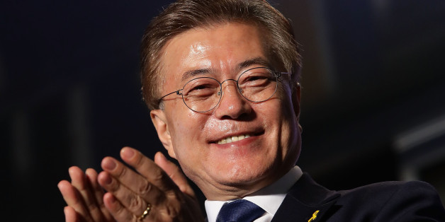 SEOUL, SOUTH KOREA - MAY 09: South Korean President-elect Moon Jae-in, of the Democratic Party of Korea, celebrates with supporters at Gwanghwamun Square on May 9, 2017 in Seoul, South Korea. Moon Jae-in declared victory in South Korea's presidential election, which was called seven months early after former President Park Geun-hye was impeached for her involvement in a corruption scandal. (Photo by Chung Sung-Jun/Getty Images)