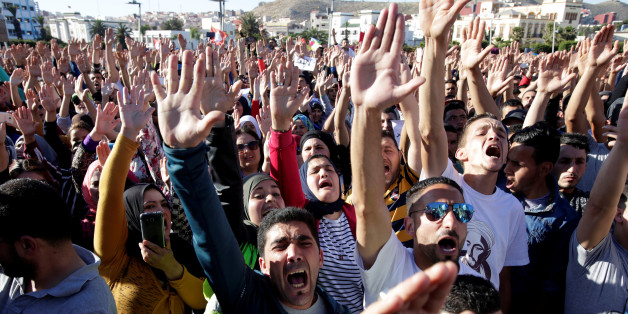 Thousands of Moroccans shout slogans during a demonstration in the northern town of Al-Hoceima, seven months after a fishmonger was crushed to death inside a garbage truck as he tried to retrieve fish confiscated by the police, in Al-Hoceima, Morocco May 18, 2017. REUTERS/Youssef Boudlal