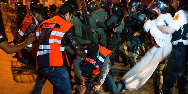 Moroccan police clash with protestors during a demonstration against corruption, repression and unemployment in the northern city of al-Hoceima on May 27, 2017. In Morocco's neglected Rif region, where outrage erupted last year over the gruesome death of a fishmonger, calls for justice have evolved into a grassroots movement demanding jobs and hospitals. / AFP PHOTO / FADEL SENNA (Photo credit should read FADEL SENNA/AFP/Getty Images)