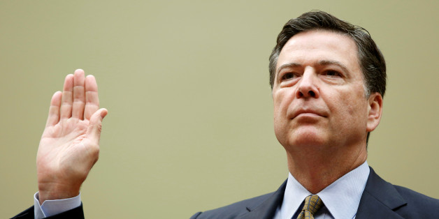 Director James Comey is sworn in before testifying at a House Oversight and Government Reform Committee on the "Oversight of the State Department" in Washington U.S. July 7, 2016. REUTERS/Gary Cameron