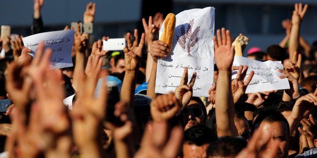 Thousands of Moroccans shout slogans during a demonstration in the northern town of Al-Hoceima, seven months after a fishmonger was crushed to death inside a garbage truck as he tried to retrieve fish confiscated by the police, in Al-Hoceima, Morocco May 18, 2017. REUTERS/Youssef Boudlal