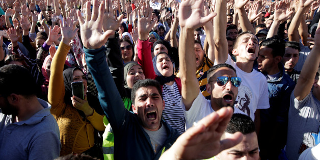 Thousands of Moroccans shout slogans during a demonstration in the northern town of Al-Hoceima, seven months after a fishmonger was crushed to death inside a garbage truck as he tried to retrieve fish confiscated by the police, in Al-Hoceima, Morocco May 18, 2017. REUTERS/Youssef Boudlal