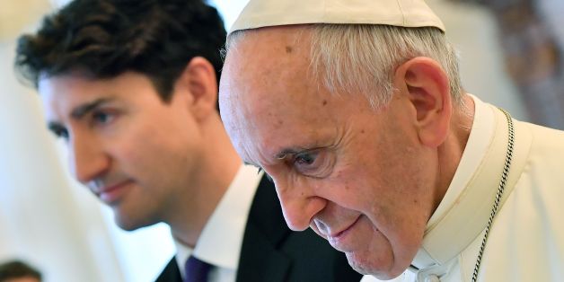 Pope Francis (R) walks with Canadian Prime Minister Justin Trudeau at the end of a private audience at the Vatican on May 29, 2017. / AFP PHOTO / POOL / Ettore FERRARI (Photo credit should read ETTORE FERRARI/AFP/Getty Images)